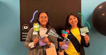 Interpreters posing in GLOBO's photobooth at the Carnival of Cultures event