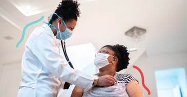 Nurse listening to patient's heart